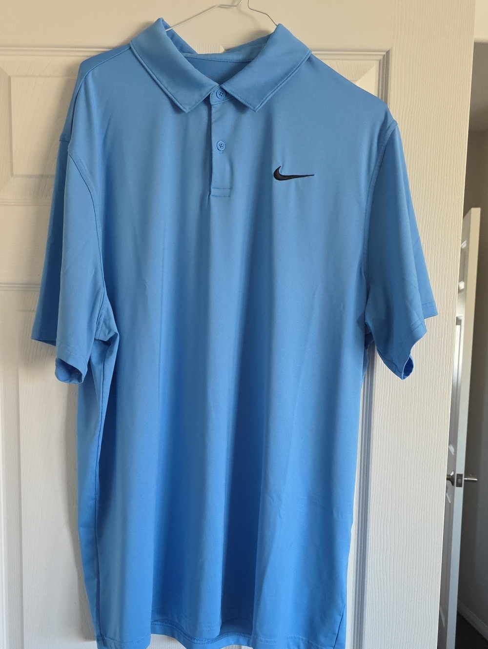 Nike Men’s Sky Blue Polo Shirt with Black Swoosh